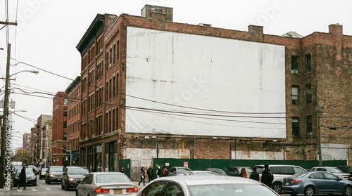 Mockup of a large blank billboard on an old city building