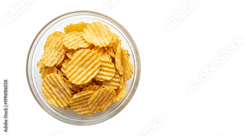 Overhead view of ridged potato chips in a clear glass bowl against a clean white background