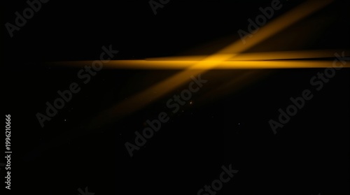 Abstract yellow light beams crossing in darkness