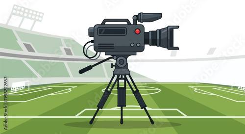 A professional broadcast camera on a tripod capturing live action on a vibrant green sports field inside a large stadium.