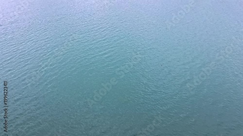 Haines - Alaska - USA - April 21, 2024 - Surface patterns in blue waters, featuring ripples and subtle reflections, creating a textured aquatic view. The water shows shades of blue.
