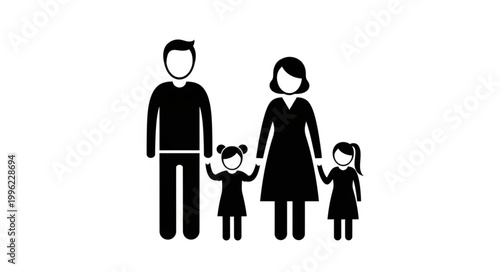 Happy family of four standing together in silhouette.