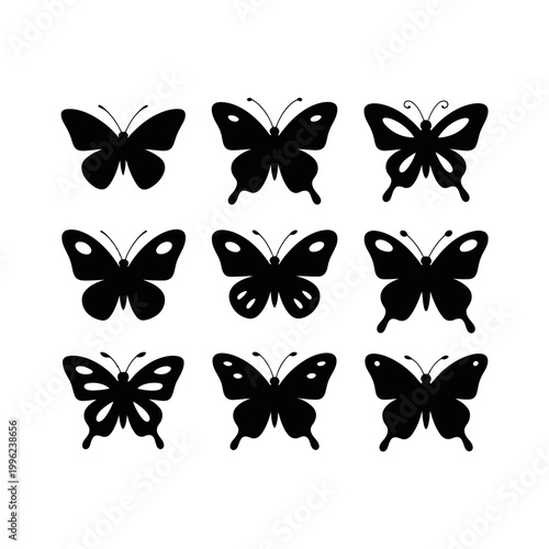 A set of black butterfly silhouettes on a beige background