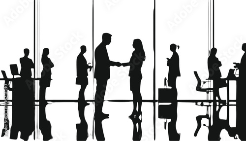 Employees work inside a bright office space while standing near large windows during the workday.