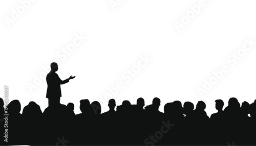 Speaker silhouette stands before a large audience to deliver a formal presentation on a white stage.