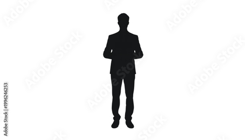 Businessman remains standing in a formal pose to represent leadership within a corporate environment.
