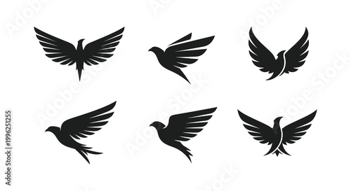 A collection of six black bird shapes in various flight poses silhouette