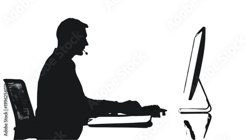Employee sits at a desk while working on a computer to manage daily tasks in a professional setting.