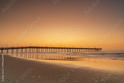 view of the Springmaid Pier in Myrtle Beach at sunrise