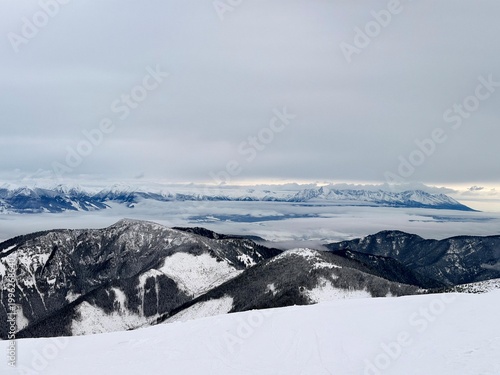 Panoramic view of Low Tatras mountains above clouds in winter landscape