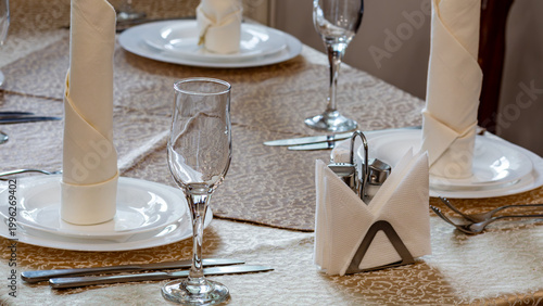 Elegant restaurant table setting with napkins and glassware