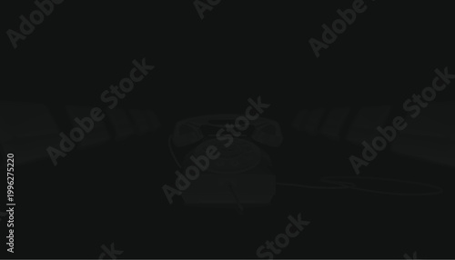 Telephone sits centered on a dark surface in this minimalist composition featuring high contrast shadows.