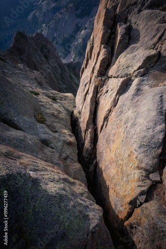 Narrow Crevice Detail in Mountain Rock Formation on Sunny Day
