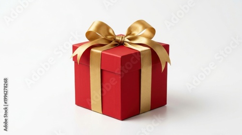 Red gift box with golden ribbon on white background, surprise present for special occasion.