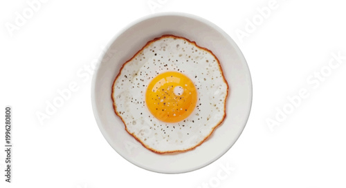 Vector illustration of top view of a fried egg with black pepper in a white bowl on a transparent background