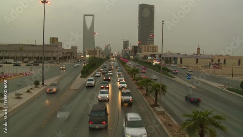 Riyadh City Skyline Aerial View Featuring Kingdom Tower and Heavy Traffic Flow on King Fahd Road, Saudi Arabia.