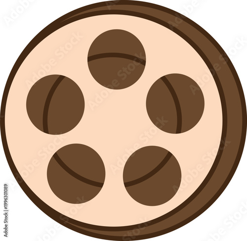 A plate of chocolate truffles sits on a table indoors.