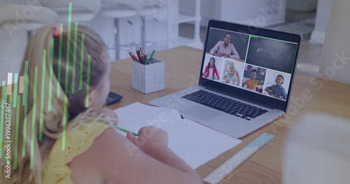 Writing child wearing yellow top joining online class at desk, laptop and notebook, copy space