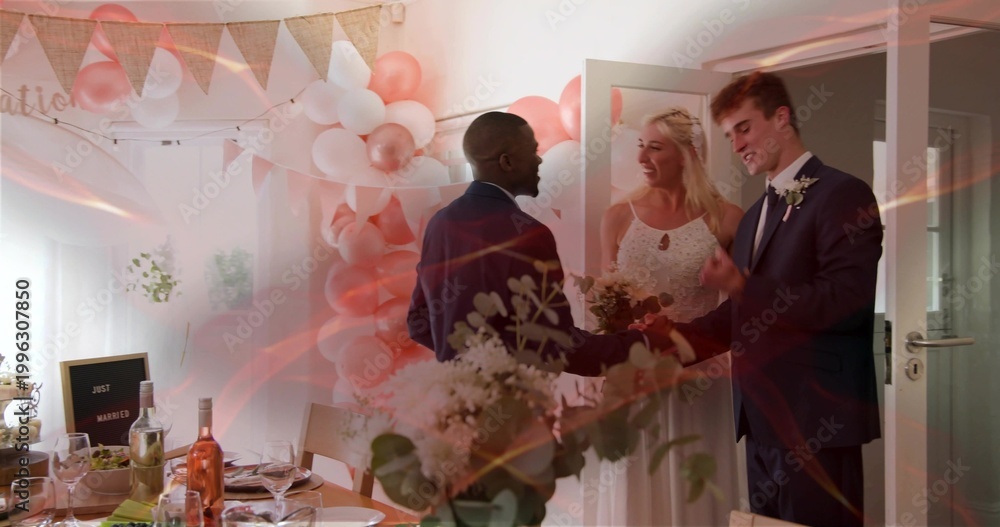 Fototapeta premium Greeting newlyweds wearing wedding attire at reception doorway, with bouquet, balloons and table