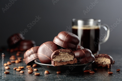 Cuadro en lienzo Chocolate-covered coffee soufflé cookies and cup of black coffee.