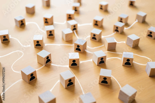 Organizational network structure with connected people icons on wooden blocks,  stakeholder mapping, social graph, and business communication on a light background