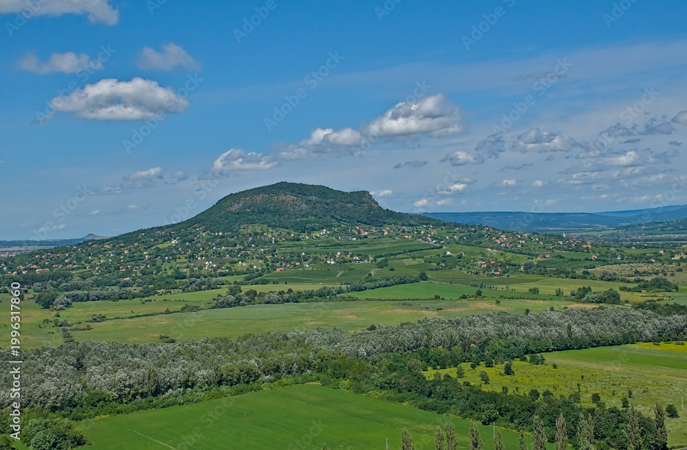 Obraz premium Sunny summer landscape with meadows and hills along Balaton lake on a sunny summer day near Keszthely, Hungary 