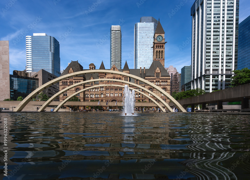 Naklejka premium Nathan Phillips Square Reflecting Pool, Freedom Arches and Toronto Old City Hall - Toronto, Ontario, Canada