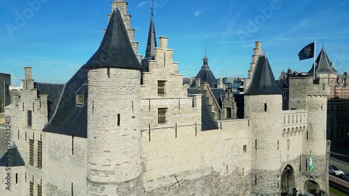 Aerial drone shot of Het Steen, a medieval fortress in the old city center of Antwerp, Belgium. View of the castle located on the banks of the Scheldt river.