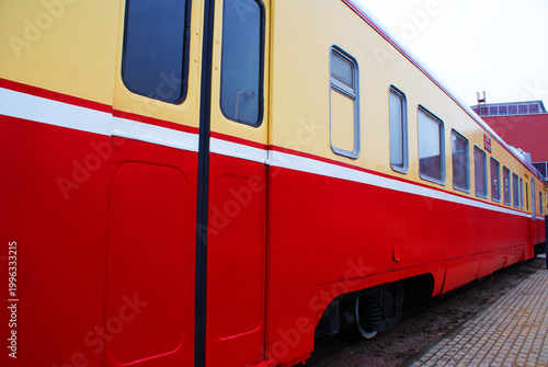 Old brightly painted commuter train. Train. Travel.