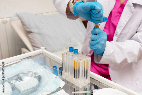 Blood plasma in tubes. Regenerative medicine. Lab technician holding test tube of blood sample after being centrifuged. Non-surgical procedures. Blood taken from patient. Chemistry laboratory