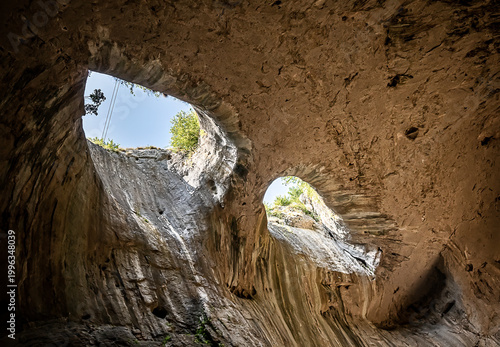 Prohodna cave also known as God's eyes near Karlukovo village, Bulgaria. An unusual cave that has openings that look like eyes.