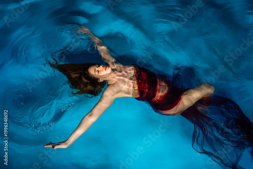 Woman Wearing a Dress Floating on Water