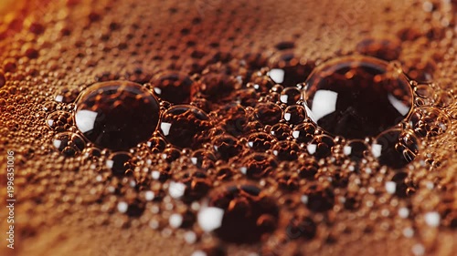 Macro shot of bubbles in dark brown coffee crema