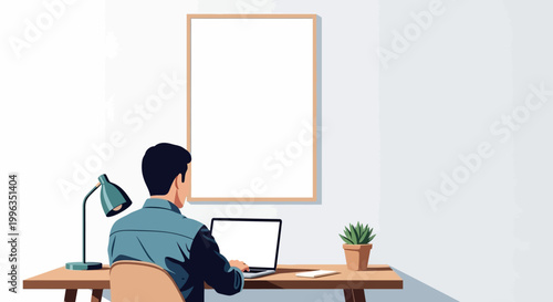 Foto A man sitting at his desk working on a laptop computer.