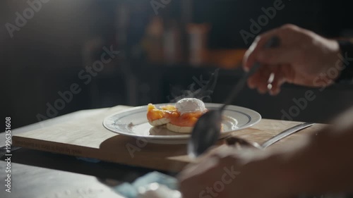 Hands place a delicate egg onto fresh toast. Warm light spills across the wooden board. Chef's focus shines through the steam and action. Perfect for food blogs or fine dining ads