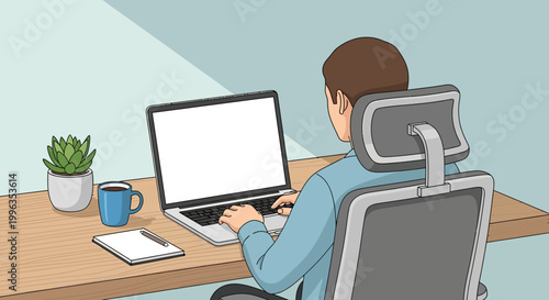A man sitting at a desk working on a laptop computer.
