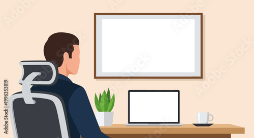 Professional man sitting at desk with laptop and blank frame.