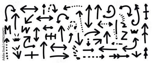 Collection of hand drawn black ink arrows and doodle symbols on a white background featuring various shapes including straight curved dotted and double headed pointers for