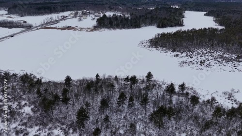 Winter aerial view featuring the Bellamy Reservoir in Madbury, New Hampshire
