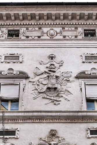 Late-Renaissance palace Bentivoglio (from 1449) is located on Via Garibaldi. Bentivoglio decorated the facade with military trophy symbols in marble. Ferrara, Region of Emilia-Romagna, Italy.