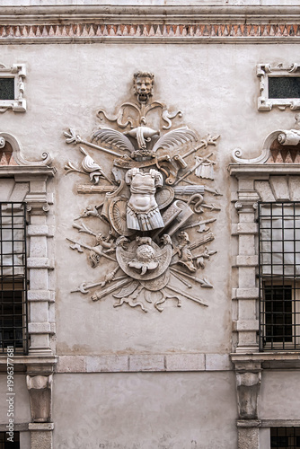 Late-Renaissance palace Bentivoglio (from 1449) is located on Via Garibaldi. Bentivoglio decorated the facade with military trophy symbols in marble. Ferrara, Region of Emilia-Romagna, Italy.
