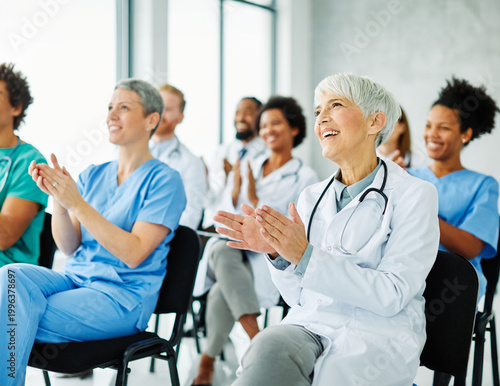 Foto Portrait of a young doctors and nurses in audiance during a seminar in a board r