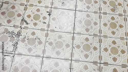 Vintage ceramic floor tiles with floral pattern
