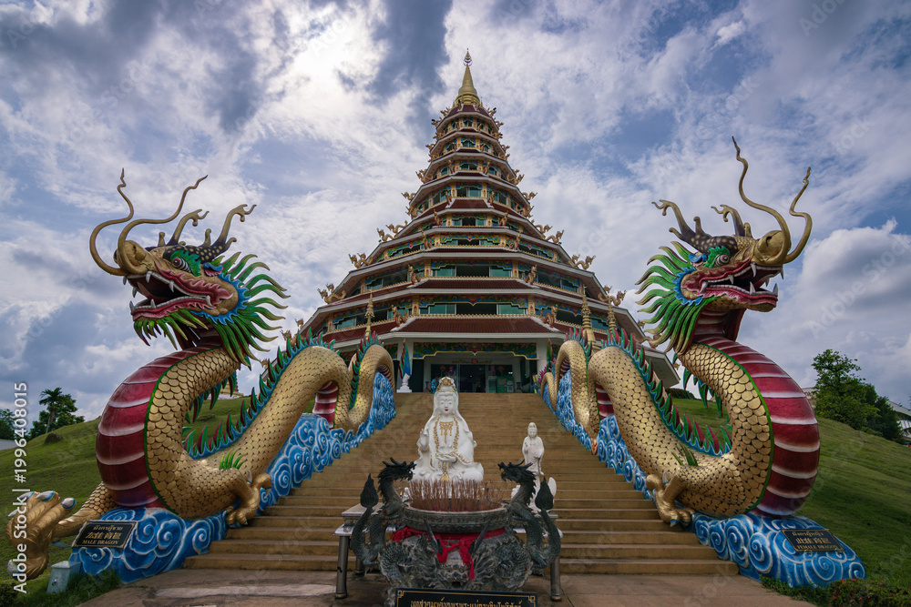 Fototapeta premium Giant white Guanyin statue and pagoda at Wat Huay Pla Kang temple in Chiang Rai, Thailand