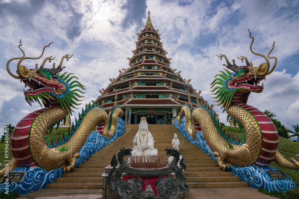 Fototapeta premium Giant white Guanyin statue and pagoda at Wat Huay Pla Kang temple in Chiang Rai, Thailand