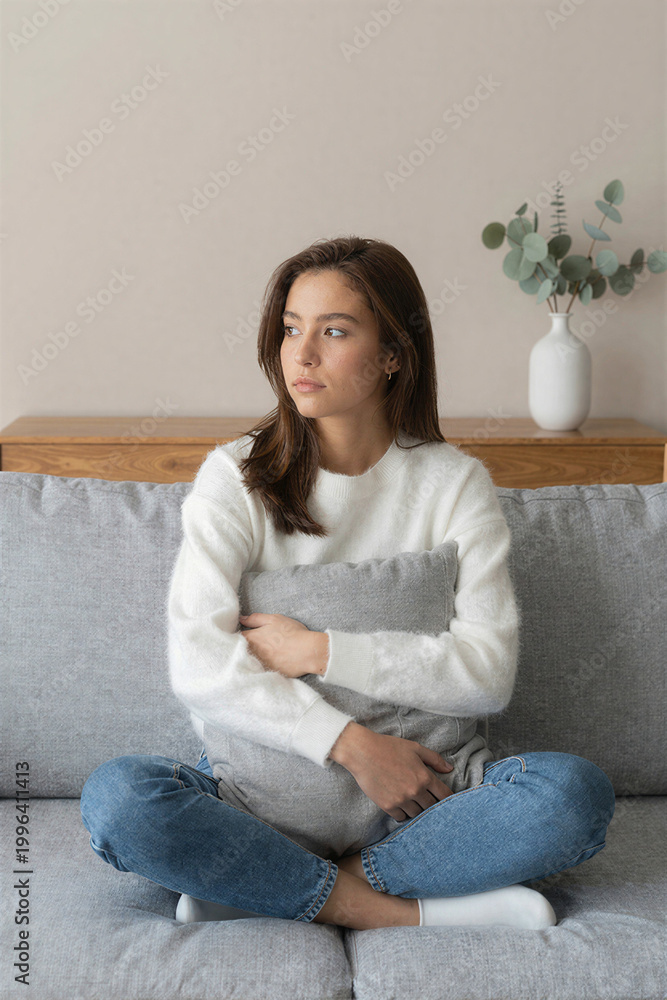 Fototapeta premium Thoughtful Woman on Sofa