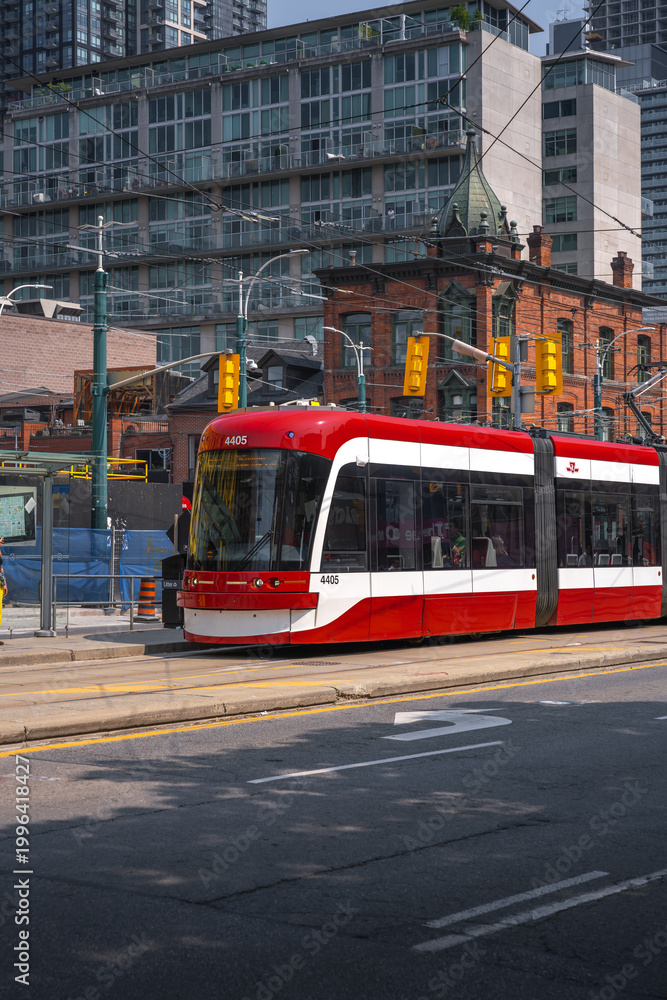 Fototapeta premium Toronto streetcar - red and white public transport tram - Toronto, Ontario, Canada