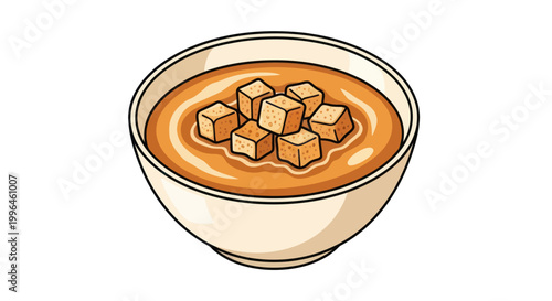 A comforting bowl of creamy soup with crispy croutons.