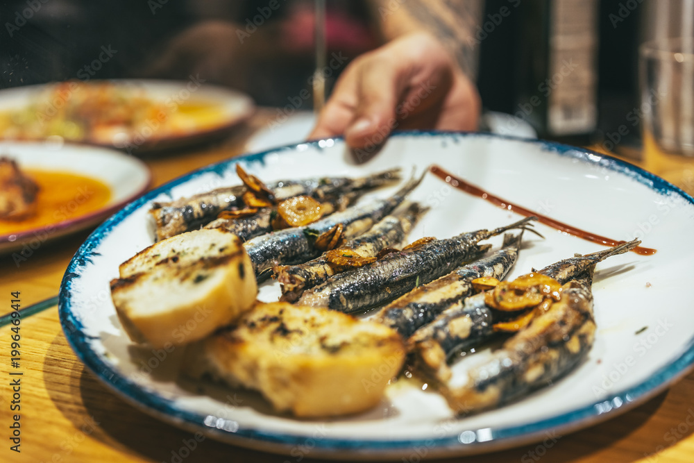 Fototapeta premium Traditional Basque pintxos sardines on plate close up