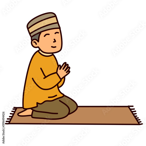 Young boy sitting on mat praying sincerely